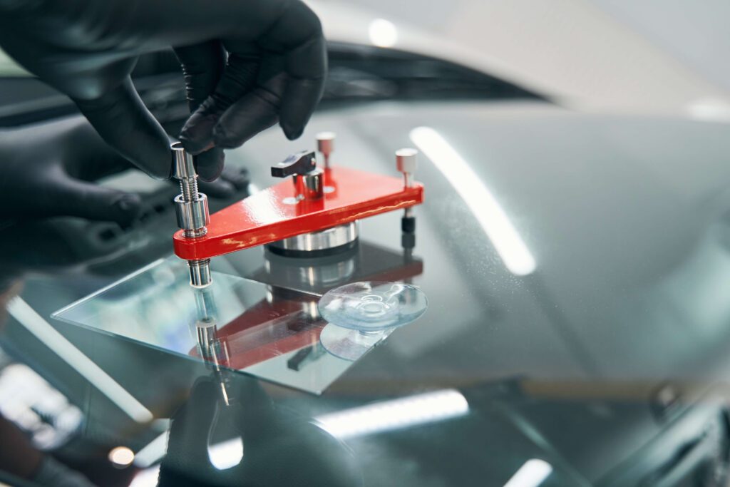 Chip repair tool set up over a chip in a windshield